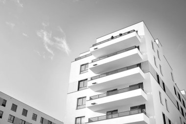 Modern and new apartment building. Multistoried, modern, new and stylish living block of flats. Black and white.