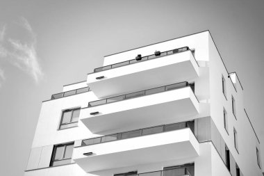 Modern and new apartment building. Multistoried, modern, new and stylish living block of flats. Black and white.