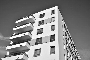 Modern and new apartment building. Multistoried, modern, new and stylish living block of flats. Black and white.