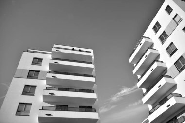 Modern and new apartment building. Multistoried, modern, new and stylish living block of flats. Black and white.