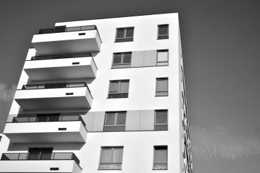 Modern and new apartment building. Multistoried, modern, new and stylish living block of flats. Black and white.