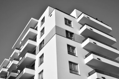 Modern and new apartment building. Multistoried, modern, new and stylish living block of flats. Black and white.