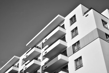 Modern and new apartment building. Multistoried, modern, new and stylish living block of flats. Black and white.