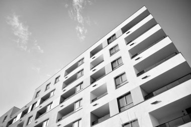 Modern and new apartment building. Multistoried, modern, new and stylish living block of flats. Black and white.