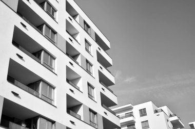 Modern and new apartment building. Multistoried, modern, new and stylish living block of flats. Black and white.