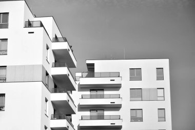 Modern and new apartment building. Multistoried, modern, new and stylish living block of flats. Black and white.