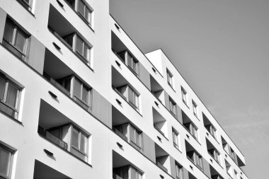 Modern and new apartment building. Multistoried, modern, new and stylish living block of flats. Black and white.