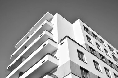 Modern and new apartment building. Multistoried, modern, new and stylish living block of flats. Black and white.