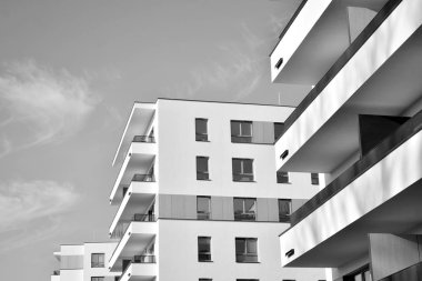 Modern and new apartment building. Multistoried, modern, new and stylish living block of flats. Black and white.