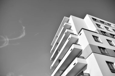 Modern and new apartment building. Multistoried, modern, new and stylish living block of flats. Black and white.