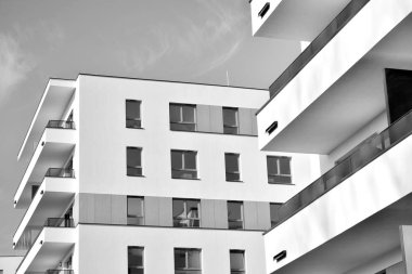Modern and new apartment building. Multistoried, modern, new and stylish living block of flats. Black and white.