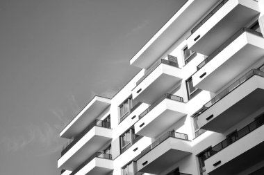 Modern and new apartment building. Multistoried, modern, new and stylish living block of flats. Black and white.