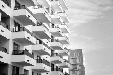 Modern and new apartment building. Multistoried, modern, new and stylish living block of flats. Black and white.