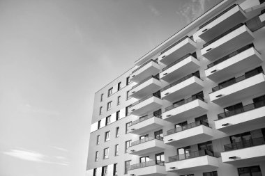 Modern and new apartment building. Multistoried, modern, new and stylish living block of flats. Black and white.