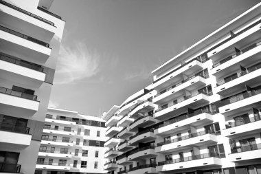 Modern and new apartment building. Multistoried, modern, new and stylish living block of flats. Black and white.