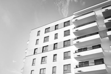 Modern and new apartment building. Multistoried, modern, new and stylish living block of flats. Black and white.