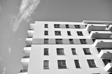 Modern and new apartment building. Multistoried, modern, new and stylish living block of flats. Black and white.