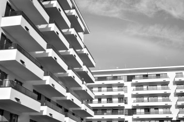 Modern and new apartment building. Multistoried, modern, new and stylish living block of flats. Black and white.