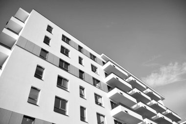 Modern and new apartment building. Multistoried, modern, new and stylish living block of flats. Black and white.