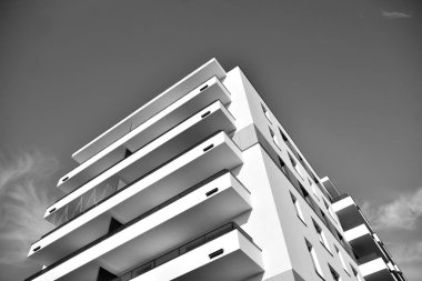 Modern and new apartment building. Multistoried, modern, new and stylish living block of flats. Black and white.