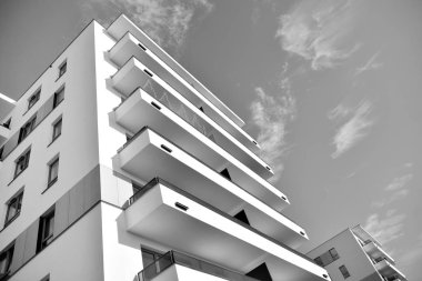 Modern and new apartment building. Multistoried, modern, new and stylish living block of flats. Black and white.