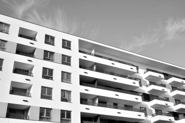 Modern and new apartment building. Multistoried, modern, new and stylish living block of flats. Black and white.