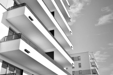 Modern and new apartment building. Multistoried, modern, new and stylish living block of flats. Black and white.