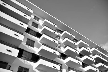 Modern and new apartment building. Multistoried, modern, new and stylish living block of flats. Black and white.