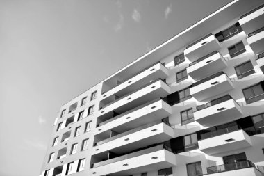 Modern and new apartment building. Multistoried, modern, new and stylish living block of flats. Black and white.