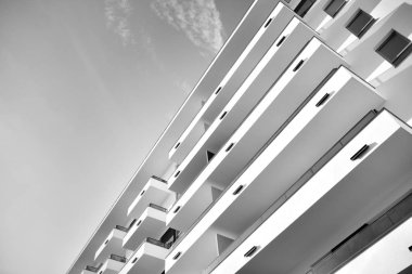 Modern and new apartment building. Multistoried, modern, new and stylish living block of flats. Black and white.