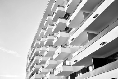 Modern and new apartment building. Multistoried, modern, new and stylish living block of flats. Black and white.