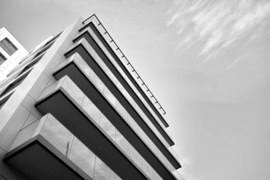 Modern and new apartment building. Multistoried, modern, new and stylish living block of flats. Black and white.