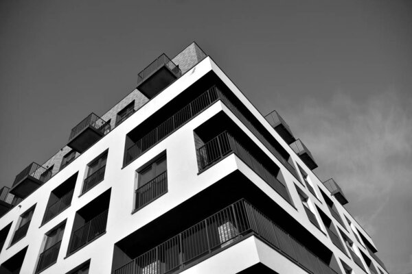 Modern and new apartment building. Multistoried, modern, new and stylish living block of flats. Black and white.