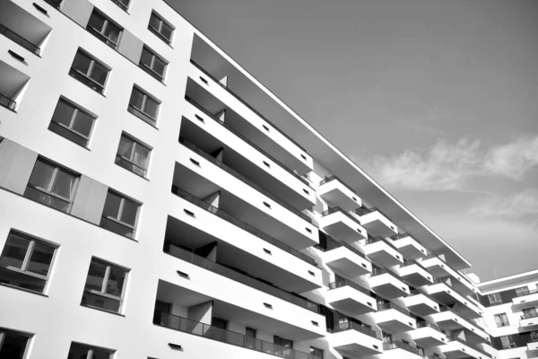 Modern and new apartment building. Multistoried, modern, new and stylish living block of flats. Black and white.