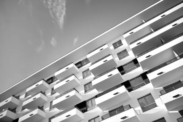 Modern and new apartment building. Multistoried, modern, new and stylish living block of flats. Black and white.