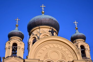 Domes of the Orthodox Church on the background of blue sky.