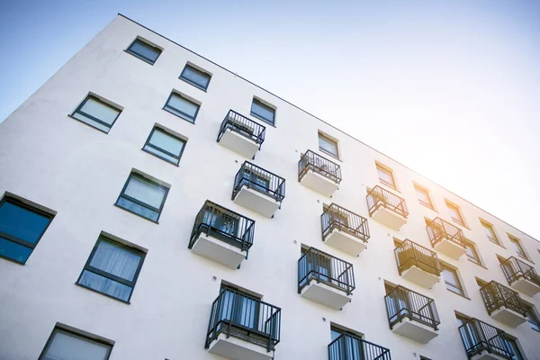 Modern apartment building flat estate concept. Outdoor residential facility at sunset and sunrise.