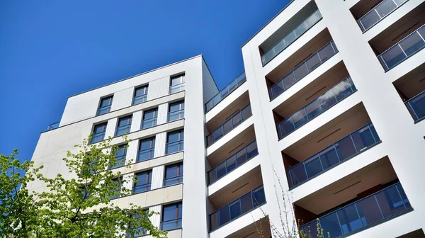 Residential Building on sky background. Facade of a modern housing construction with of balconies.