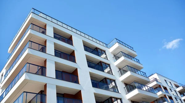 Residential Building on sky background. Facade of a modern housing construction with of balconies.