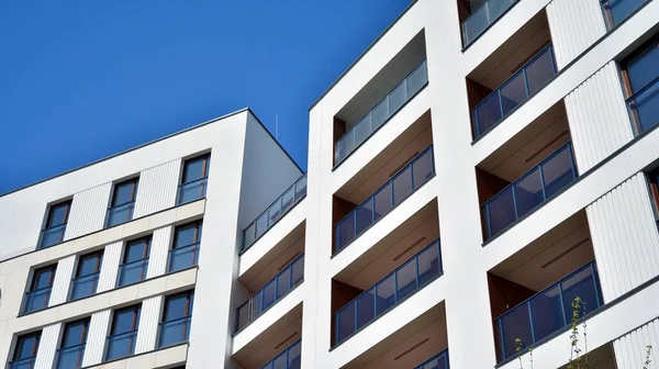 Residential Building on sky background. Facade of a modern housing construction with of balconies.