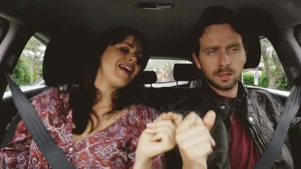 Happy funny couple dancing in car in love — Stock Video