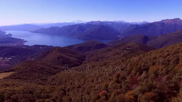 Autumn view of trees lake Maggiore Italy and mountains with snow aerial shot — Stock Video