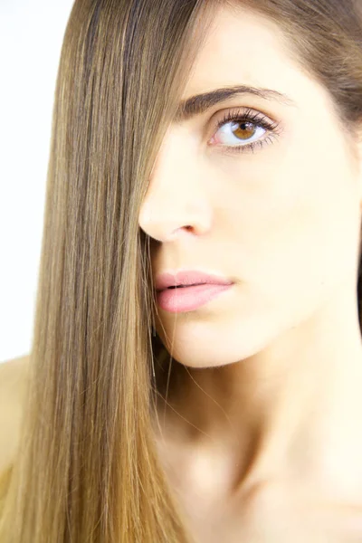 Medium shot  of beautiful model with long hair looking at camera — Stock Photo, Image