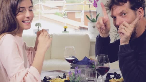 Happy couple showing love heart sign with hands looking camera — Stock Video