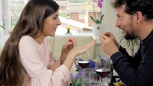 Man putting proposal ring to finger of girlfriend hugging medium shot slow motion — Stock Video
