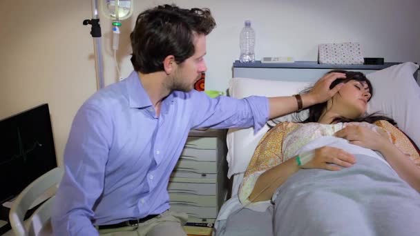 Man Caressing Girlfriend Sick Hospital Bed — Stock Video