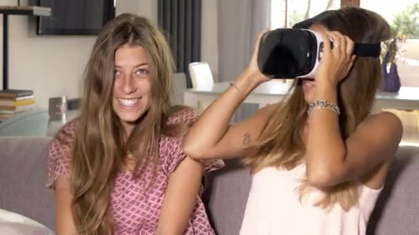 Happy girls at home trying new vr glasses medium shot — Stock Video