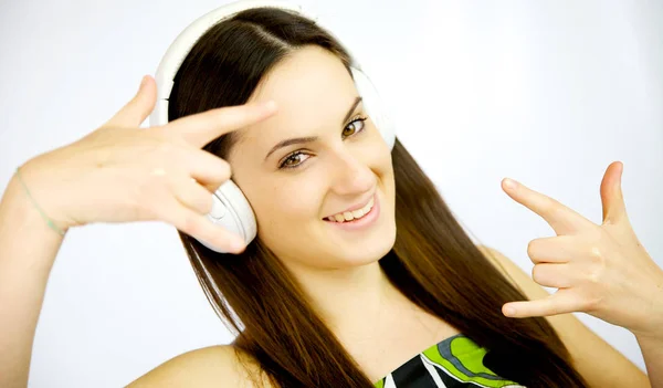 Happy woman listening music sitting on the floor isolated closeup — Stock Photo, Image