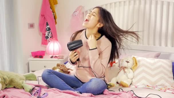 Cute Happy Young Woman Sitting Bed Singing Drying Long Hair — Stock Video
