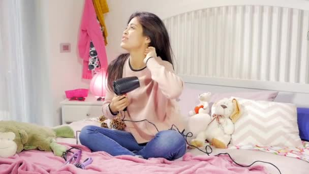 Cute Happy Young Woman Sitting Bed Singing Drying Long Hair — Stock Video
